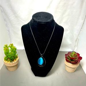 Dark gray Necklace with blue pendant. NEW.
